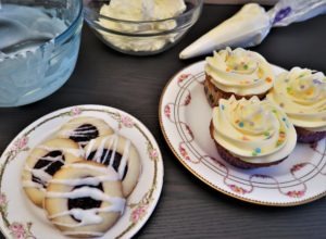 glazed cookies and cups with buttercream
